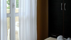 A room with a sliding glass door leading to an outdoor patio area.