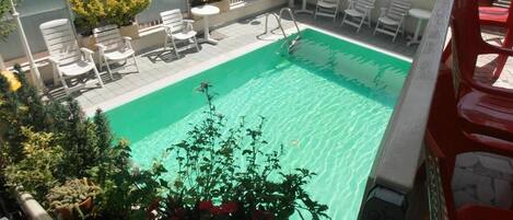 Seasonal outdoor pool, pool umbrellas, sun loungers