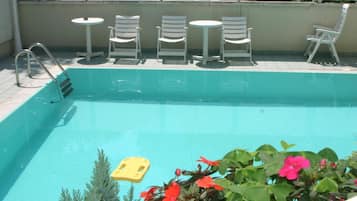 Seasonal outdoor pool, pool umbrellas, sun loungers