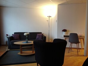 Junior Double Room, 1 King Bed with Sofa bed, Sea View | Living area | Heated floors - Arctic Inn (Gratangen)
