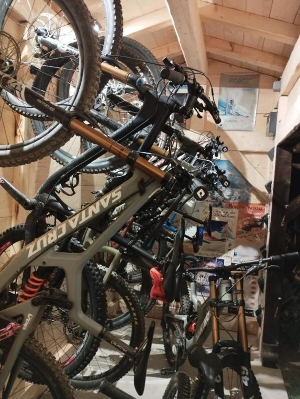 A bicycle repair shop with multiple bikes and tools.