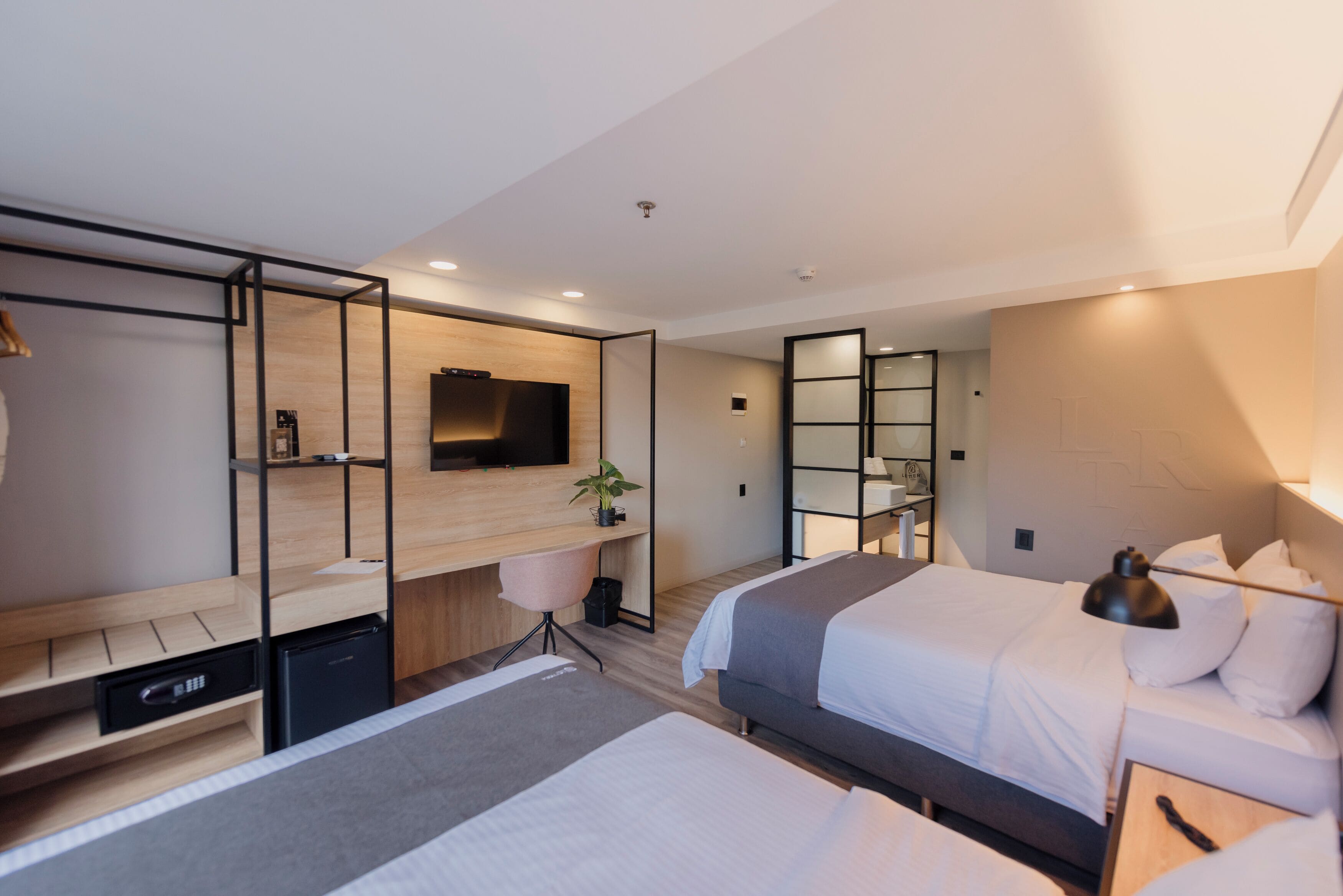 superior twin room | in-room safe, desk, laptop workspace, blackout curtains