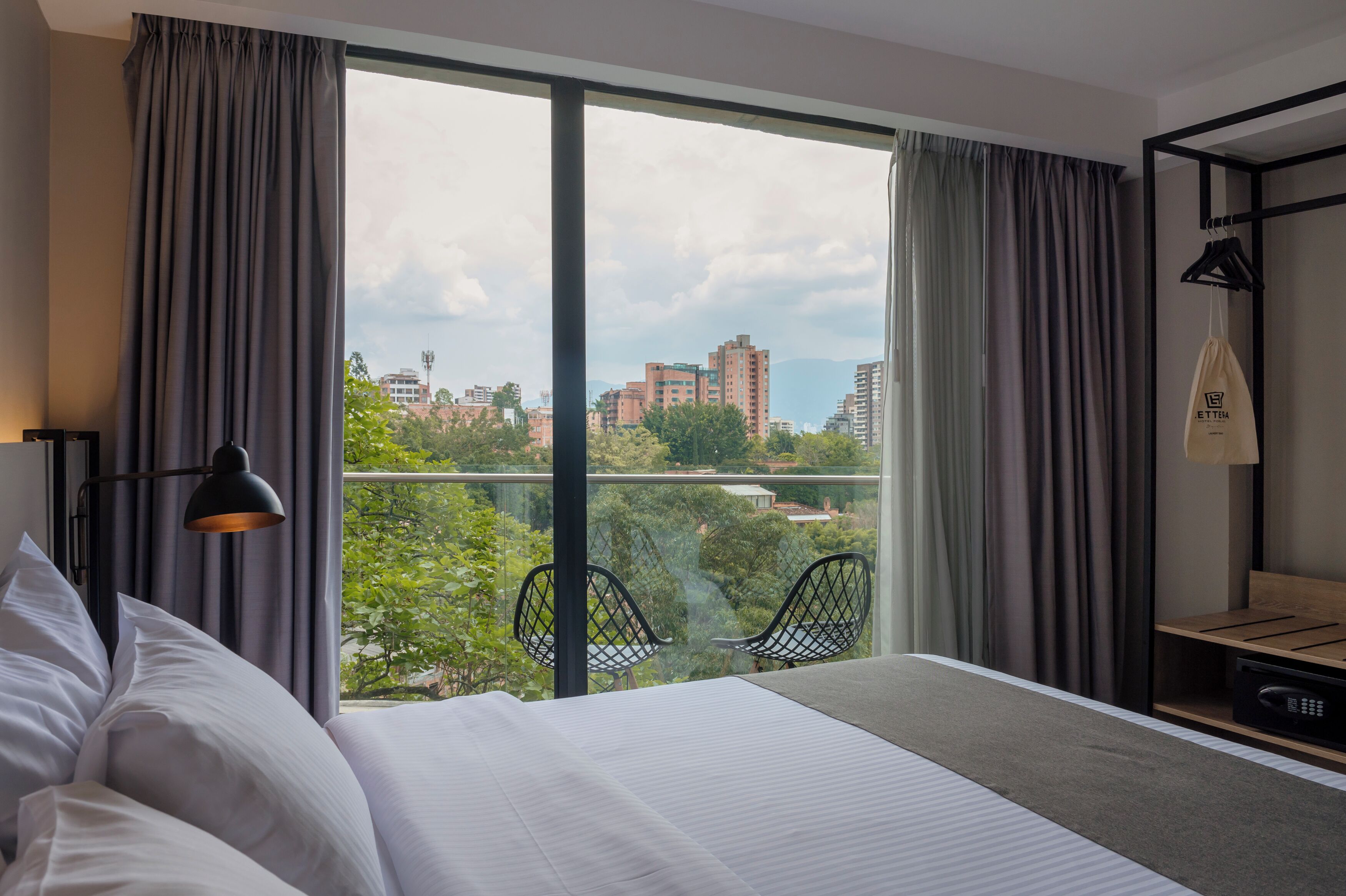 superior double room | in-room safe, desk, laptop workspace, blackout curtains