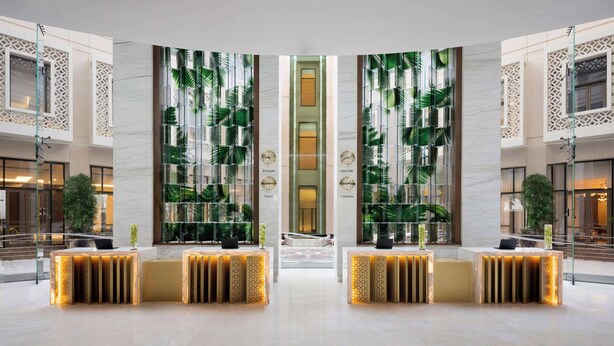 A spacious lobby with a central reception desk, mirrored walls, and a modern design. - Grand Hyatt Alkhobar Hotel and Residences (Al Khobar)