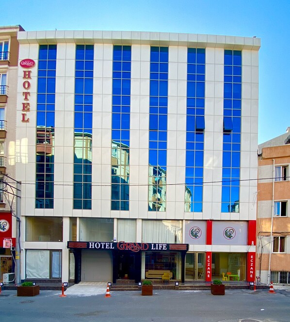 A modern hotel building with a prominent 'HOTEL GRAND LIE' sign at the entrance. - Grand Life Hotel (Corlu)