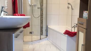 Bathtub, hair dryer, towels, soap