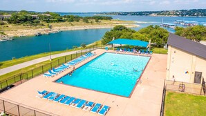 A swimming pool with lounge chairs and a view of the water. - Incredible waterfront! Relaxing!- Swim & Fish, Pool Access (Point Venture)