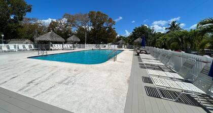 Waterfront Tiny House w Pool, Beach, and Boat Dock