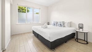 1 bedroom, desk, iron/ironing board, travel crib