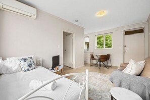 1 bedroom, desk, iron/ironing board, travel crib