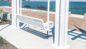 A white pergola with benches overlooking a body of water. - Modern Farmhouse Suite at The Dorley (Sandusky)