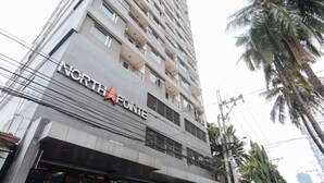 A multi-story building with the sign "NORTH POINT" on the facade. - Northpointe Residences (Quezon City)