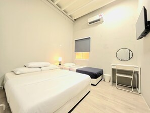 A hotel room with a large bed, a desk with a chair, a TV, a mirror, and an air conditioning unit. - No33 Mandalay House near Gleneagles Island Northern Heart Loh Guan Lye Hospital (George Town)