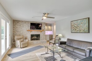 TV, fireplace, books - Waterfront Lakehouse w/ Private Dock & Fire Pit! (Chapin)