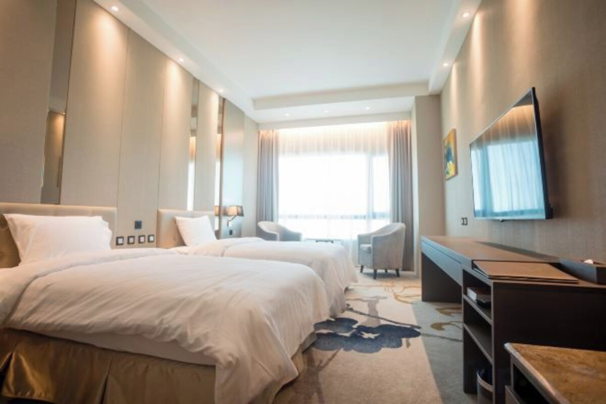 Premium bedding, down comforters, pillowtop beds, minibar