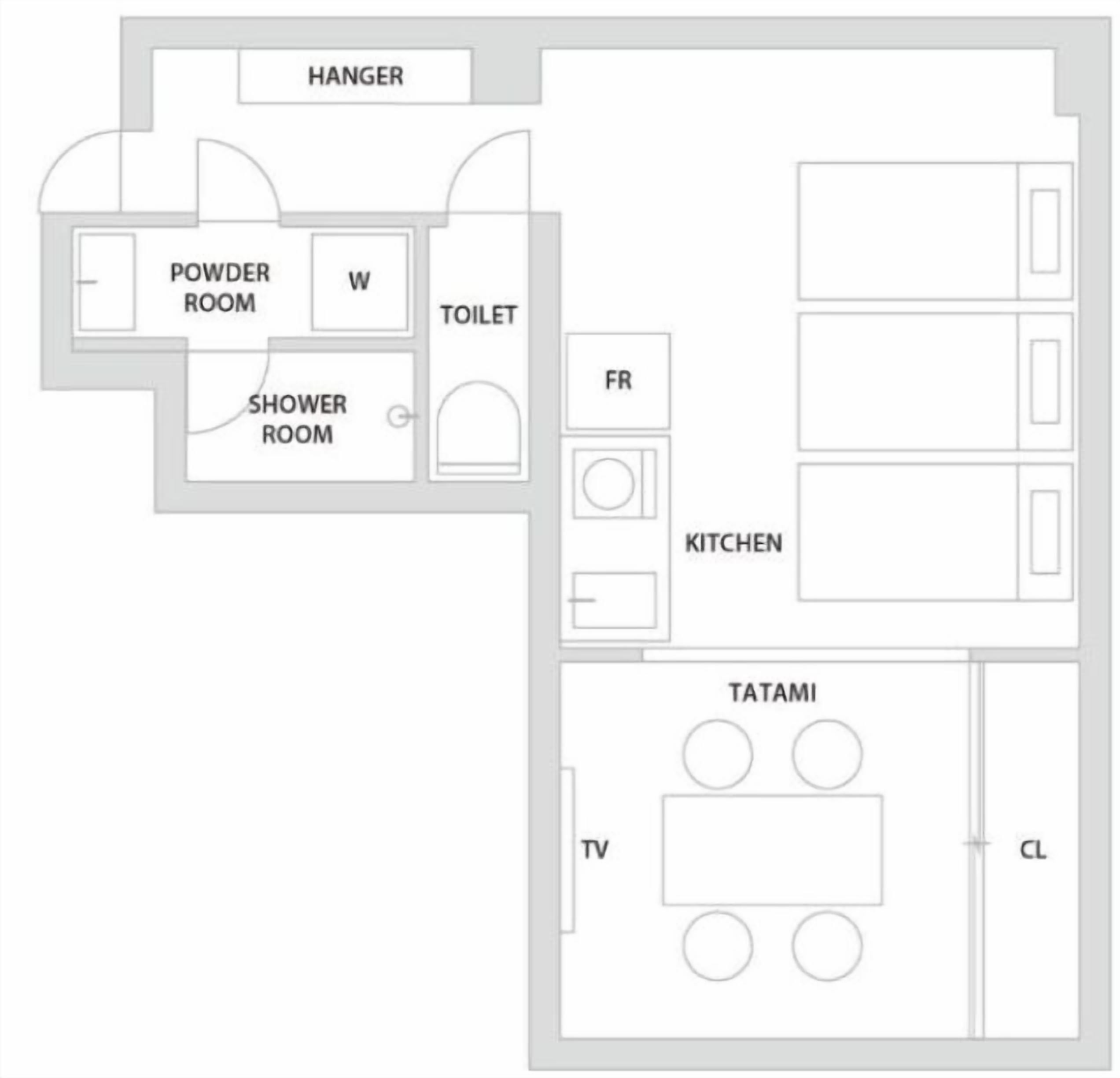 A floor plan with a powder room, shower room, toilet, kitchen, and a tatami room with a TV and a closet.
