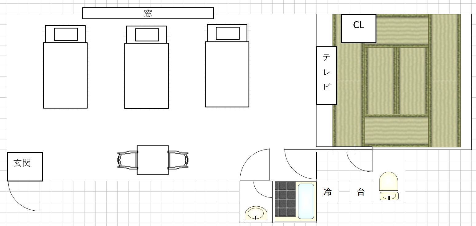 Ein Hotelzimmer mit Bett, Nachttischen, Schreibtisch und Bad.