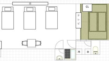 Ein Hotelzimmer mit Bett, Nachttischen, Schreibtisch und Bad.
