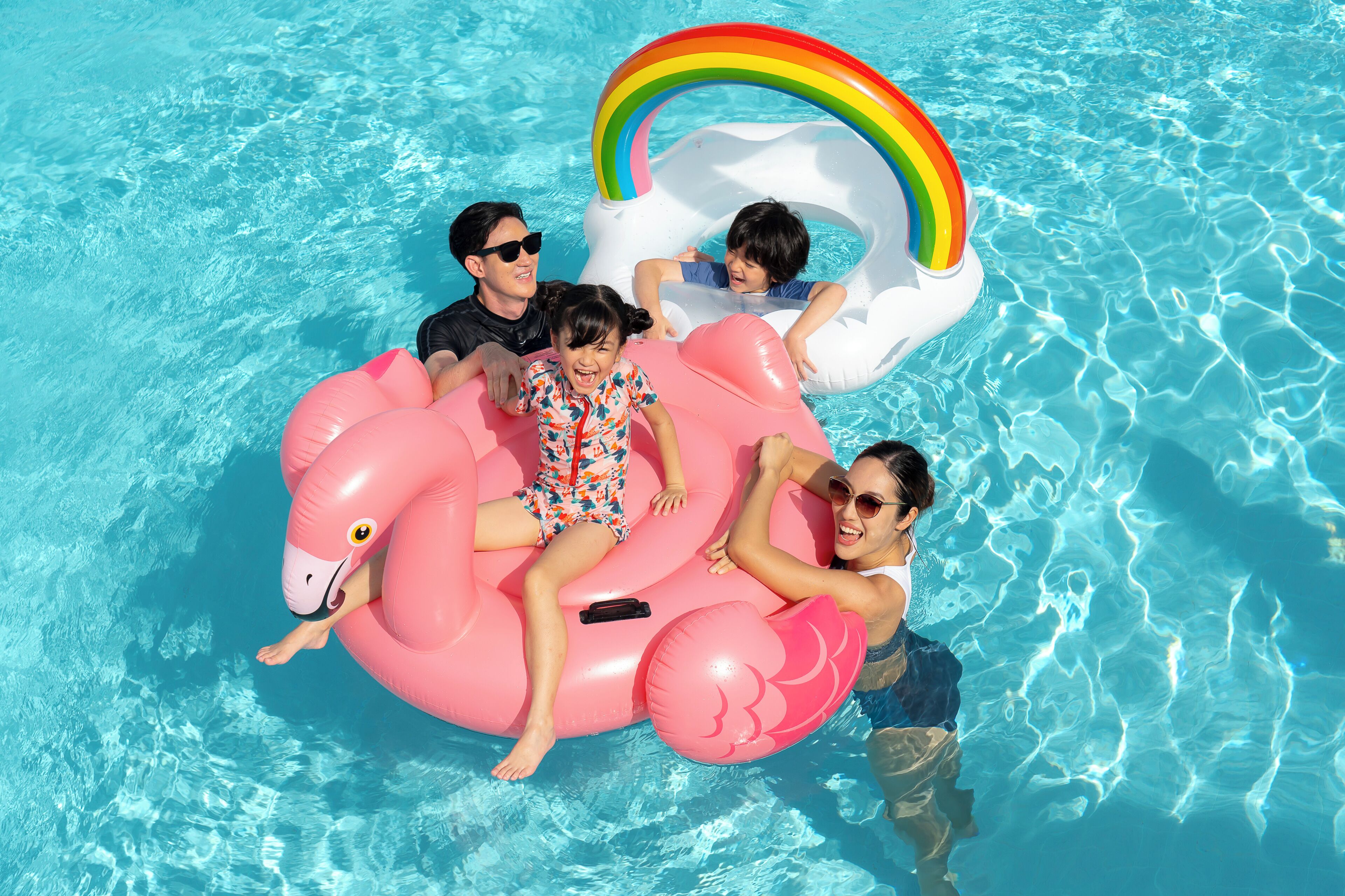 A swimming pool with inflatable floats.