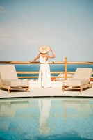 Seasonal outdoor pool, open 7:00 AM to 6:00 PM, pool umbrellas