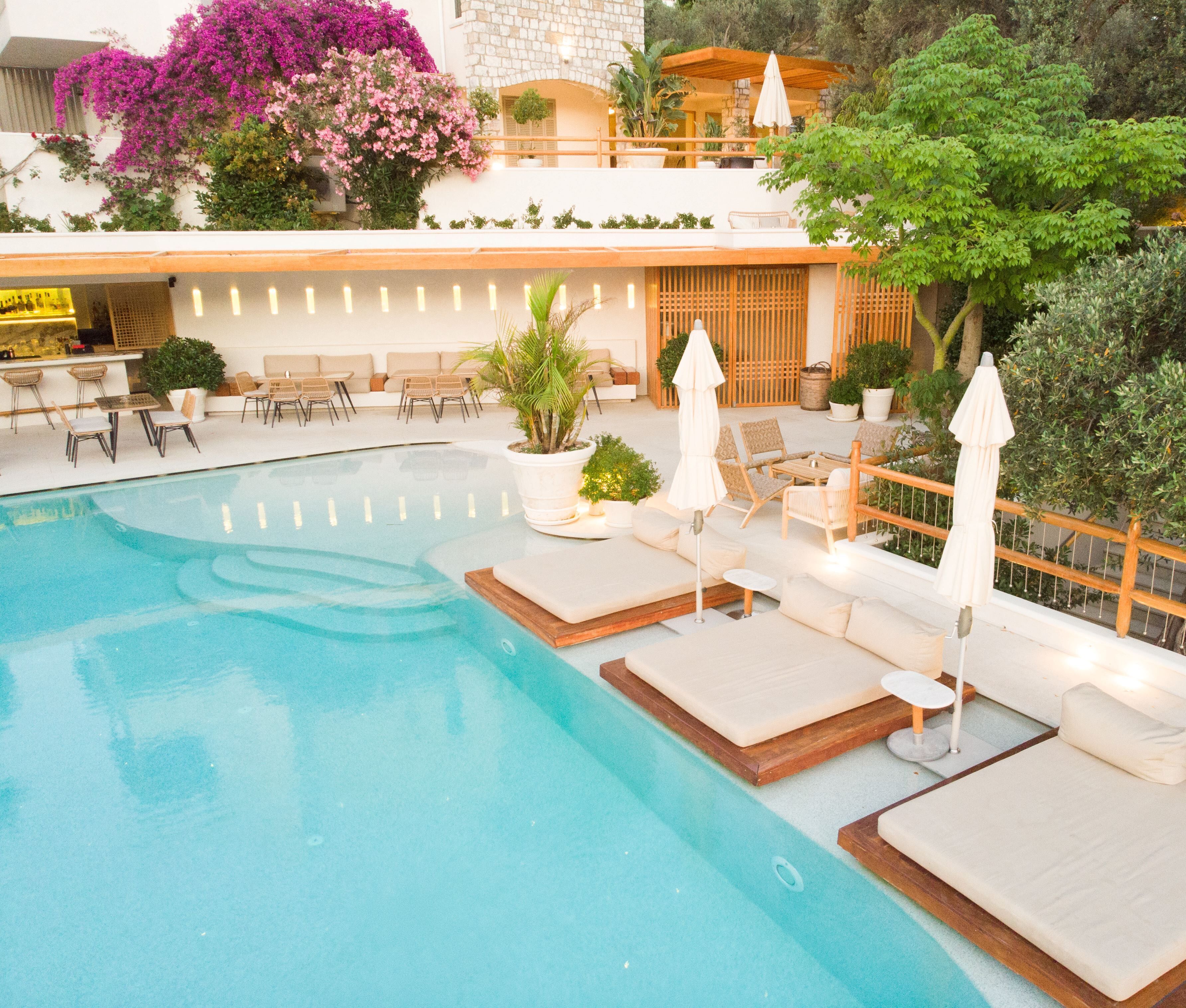 seasonal outdoor pool, open 7:00 am to 6:00 pm, pool umbrellas