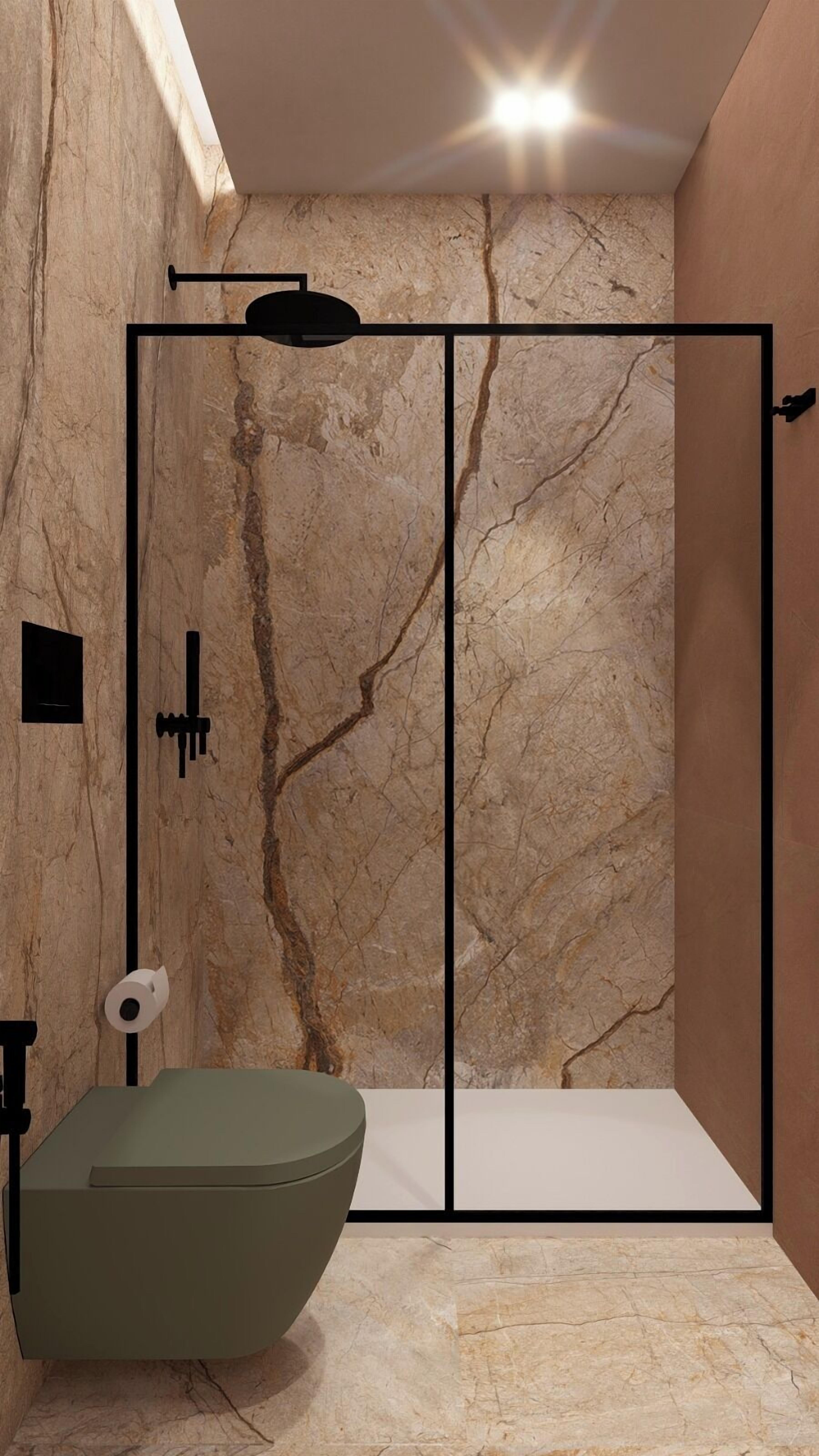 Un baño con pared de mármol, bañera verde y cabina de ducha.