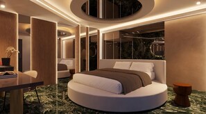 A modern bedroom with a circular bed, a desk, and a large mirror. - Giafra Rooms (Agrigento)