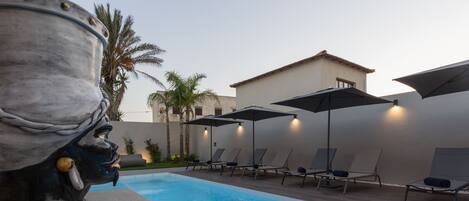Outdoor pool, pool umbrellas, sun loungers