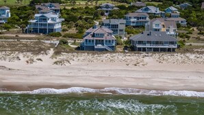 A coastal residential area with beachfront houses. - Spacious Oceanfront home near golf and pool, BHI (Bald Head Island)