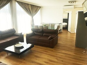 Panoramic Penthouse, 3 Bedrooms | Living room | TV, heated floors