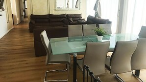 Panoramic Penthouse, 3 Bedrooms | Living area | TV, heated floors - Munich Downtown Suites (Munich)