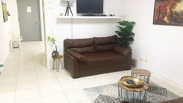 Comfort Suite | Living area | TV, heated floors