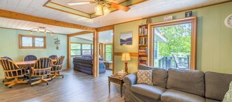 Waterfront retreat with private dock, wraparound deck & stunning lake views.