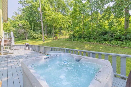 Waterfront retreat with private dock, wraparound deck & stunning lake views.