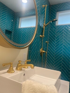 Combined shower/bathtub, hair dryer, towels, soap