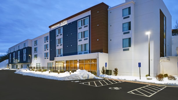 A modern hotel with multiple floors, large windows, and a sign for Springhill Suites. - Springhill Suites by Marriott Hartford Cromwell (Cromwell)