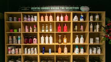 A display of various personal care products on wooden shelves with a sign above reading "RENTAL GOODS VIKING THE SELECTION".