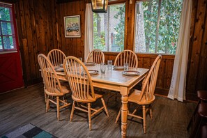 Enjoy meals in this dining area with a table for six and comfortable seating.