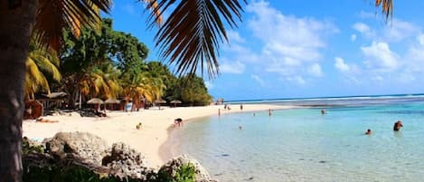 On the beach, sun loungers, beach towels