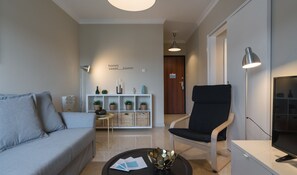 Apartment, 1 Bedroom | Living area | 20-inch flat-screen TV with cable channels, Smart TV