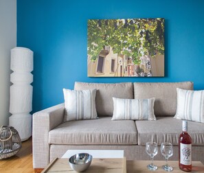 Apartment, 1 Bedroom | Living area | 20-inch flat-screen TV with cable channels, Smart TV