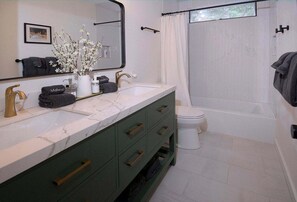 Bathtub, hair dryer, towels