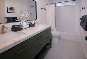 Bathtub, hair dryer, towels