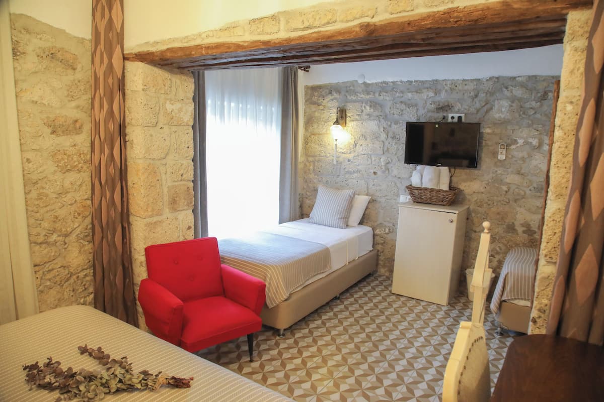 Deluxe Quadruple Room | Premium bedding, free WiFi, bed sheets