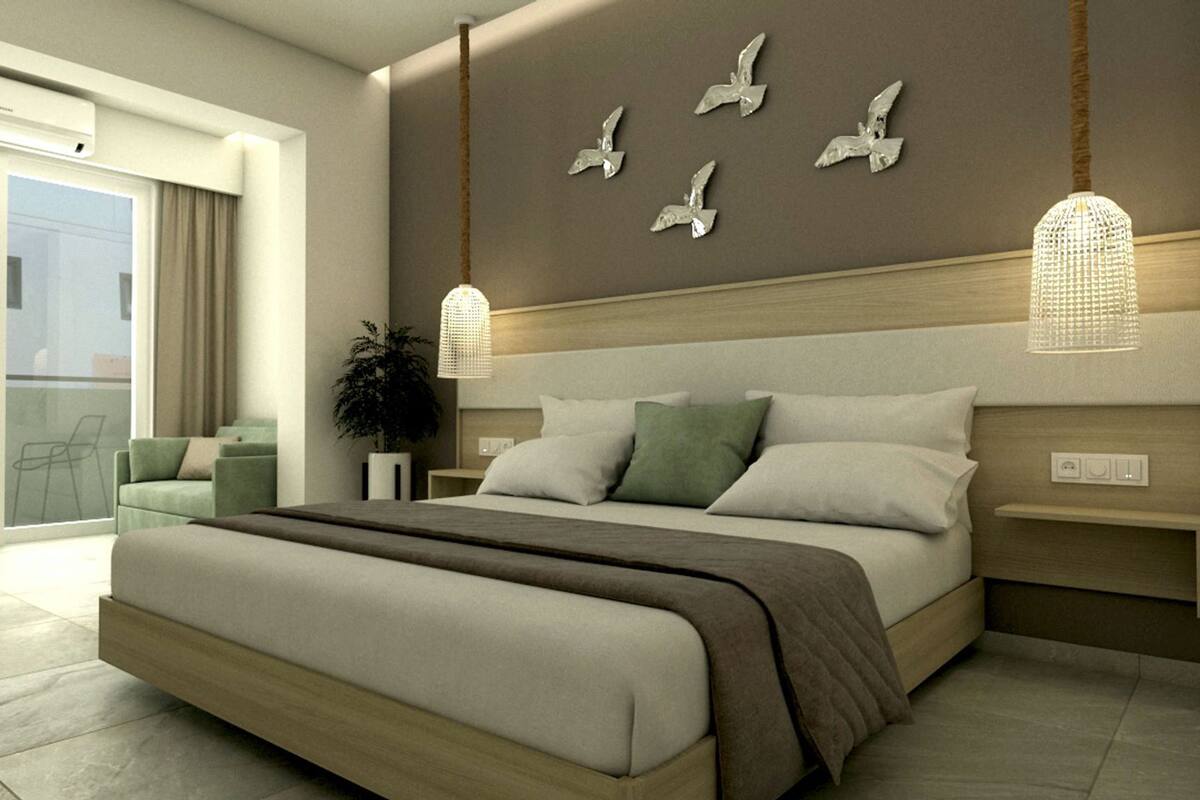 A modern bedroom with a large bed, two bedside tables, a wall-mounted light fixture, and a balcony with a chair.