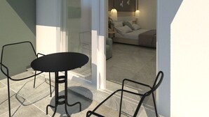 A modern interior with a glass door leading to a bedroom. There is a small table and two chairs in the foreground. - Artemis Comfort & Pleasure (Rhodes)
