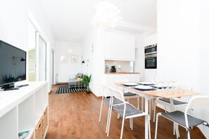 Apartment, 1 Bedroom | Living area | 20-inch flat-screen TV with cable channels, Smart TV
