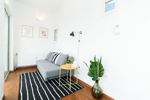 Apartment, 1 Bedroom | Living area | 20-inch flat-screen TV with cable channels, Smart TV