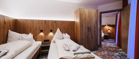 Family Quadruple Room | Minibar, in-room safe, desk, blackout drapes