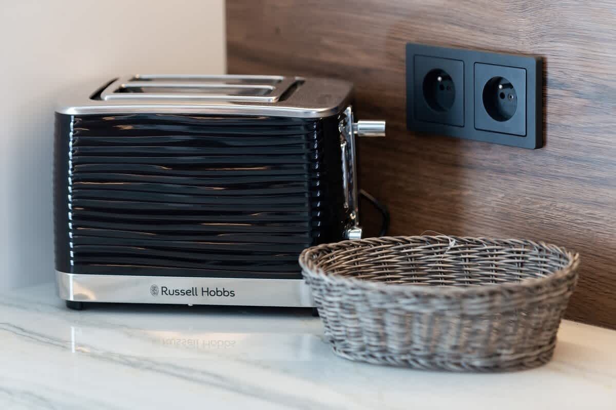 A close-up of the toaster located in the kitchenette, which is sure to come in handy in preparing a delicious breakfast.